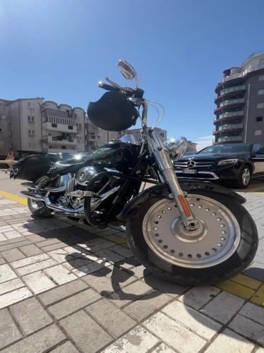 Motorcycle parked as customer visits cafe in Montenegro village