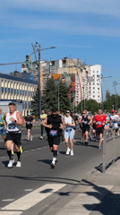 Marathon runners compete on sunny city streets
