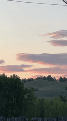 Pastoral sunset captured with rolling hills and colorful sky