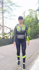Woman in athletic wear walks on path in Sochi