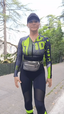 Woman in athletic wear walks on path in Sochi