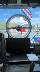 Harbor footage shows docked vessels, ship bridge equipment