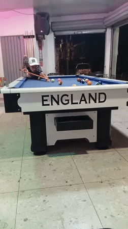 Man plays pool at indoor establishment in Jamundí, Colombia