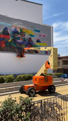 Artist paints elderly portrait mural in Mollet Del Vallès
