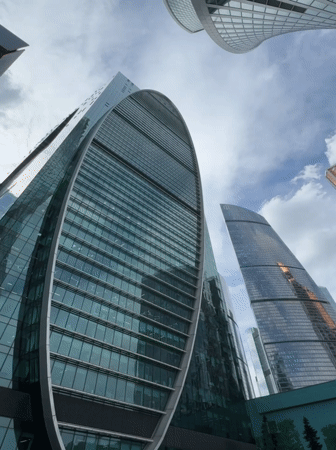 Modern skyscrapers photographed in Khimki under cloudy skies
