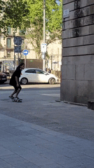 Barcelona street activities: skateboarder attempts stair trick, motorcycle photoshoot