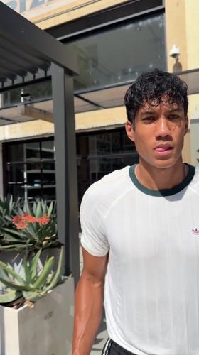 Young man in athletic wear observed outdoors in Los Angeles