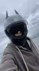 Motorcycle rider and motorboat spotted in coastal Vietnam morning