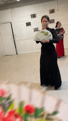 Women demonstrate decorative fans in Sochi dance studio
