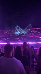 Nighttime dance event in Nesebar with glowing butterfly sculpture