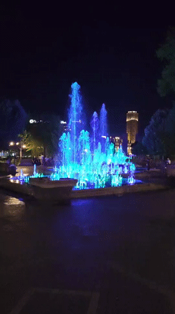 Yerevan fountain glows with shifting colored lights at night