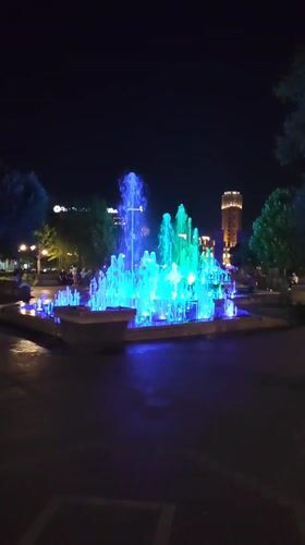 Yerevan fountain glows with shifting colored lights at night