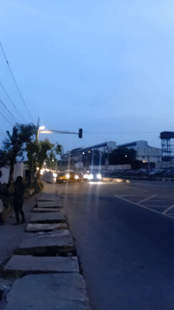 Evening street crossing captured in busy Ikeja district
