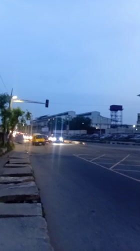 Evening street crossing captured in busy Ikeja district