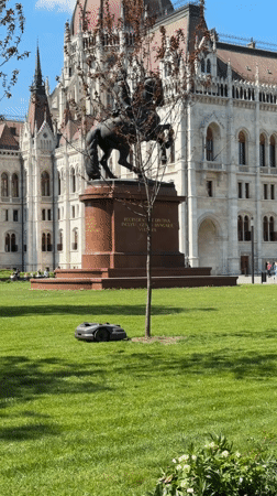 Robotic lawnmower operates at government building in Budapest