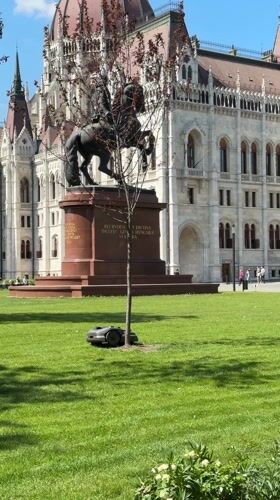 Robotic lawnmower operates at government building in Budapest