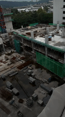 Morning snapshots capture ordinary Kuala Lumpur construction, education, parking