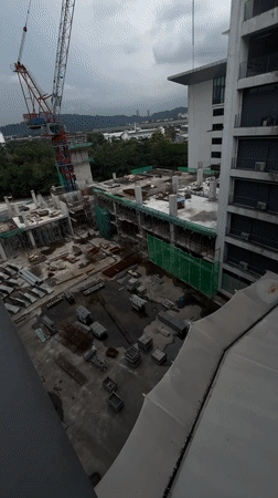 Morning snapshots capture ordinary Kuala Lumpur construction, education, parking