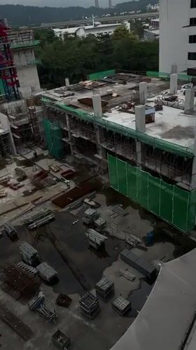 Morning snapshots capture ordinary Kuala Lumpur construction, education, parking