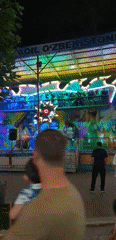 Fergana City's nightlife strip: rides, restaurants, and neon lights