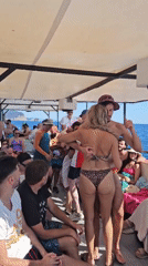 Crowded boat party cruising the Montenegro coast