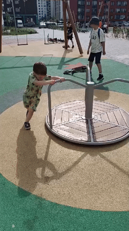 Children play at Yekaterinburg playground during morning hours