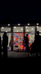 Outdoor band performs in Izhevsk with Confederate flag display