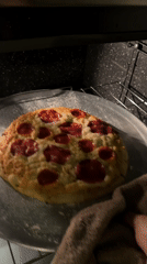 Late-night pizza removal captured in Mexican kitchen