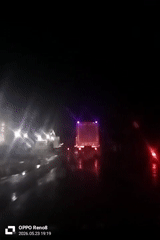 Night driving captured on wet roads in Indonesia