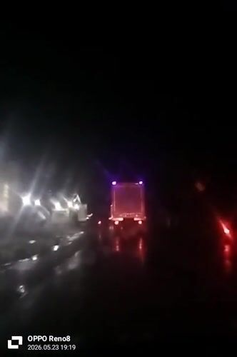 Night driving captured on wet roads in Indonesia