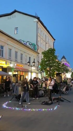 Street musicians and breakdancers perform for crowds in Kazan