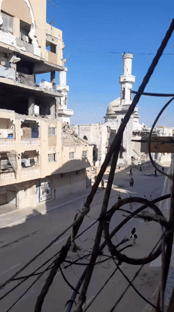 Daily life continues in al-Qarara amid widespread destruction