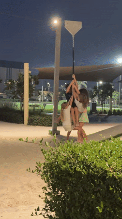 Nighttime park gathering captured in Dubai playground scenes