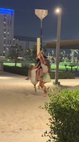 Nighttime park gathering captured in Dubai playground scenes