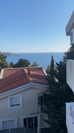 Man observed on balcony overlooking Montenegro coastline