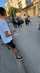Decorated car procession with waving passengers passes through Montana, Bulgaria