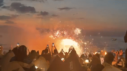 Fire dancers entertain sunset crowd at Thailand beach venue