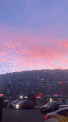 Dramatic purple-pink sunset captured over Saint Petersburg streets