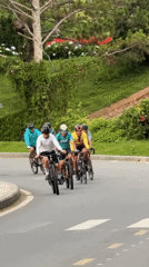 Cyclists ride through scenic Da Lat streets at night