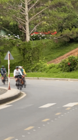 Cyclists ride through scenic Da Lat streets at night