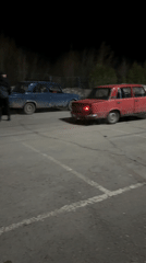 Cars doing donuts, child resting captured in Chaikovsky