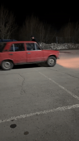 Cars doing donuts, child resting captured in Chaikovsky