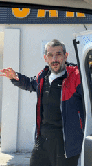 Man handles bag while closing van door in Karaburun