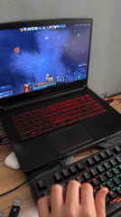 Gamer plays Dota 2 on laptop setup in Chaikovsky