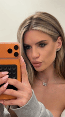 Woman records selfie content near Berlin apartment buildings