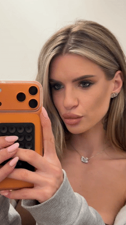 Woman records selfie content near Berlin apartment buildings