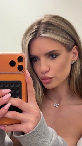 Woman records selfie content near Berlin apartment buildings