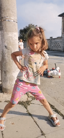Children play outdoors in Obrochishte, Bulgaria afternoon scene