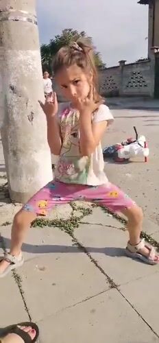 Children play outdoors in Obrochishte, Bulgaria afternoon scene