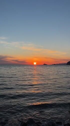 Sunset captured over ocean waters near Buljarica, Montenegro